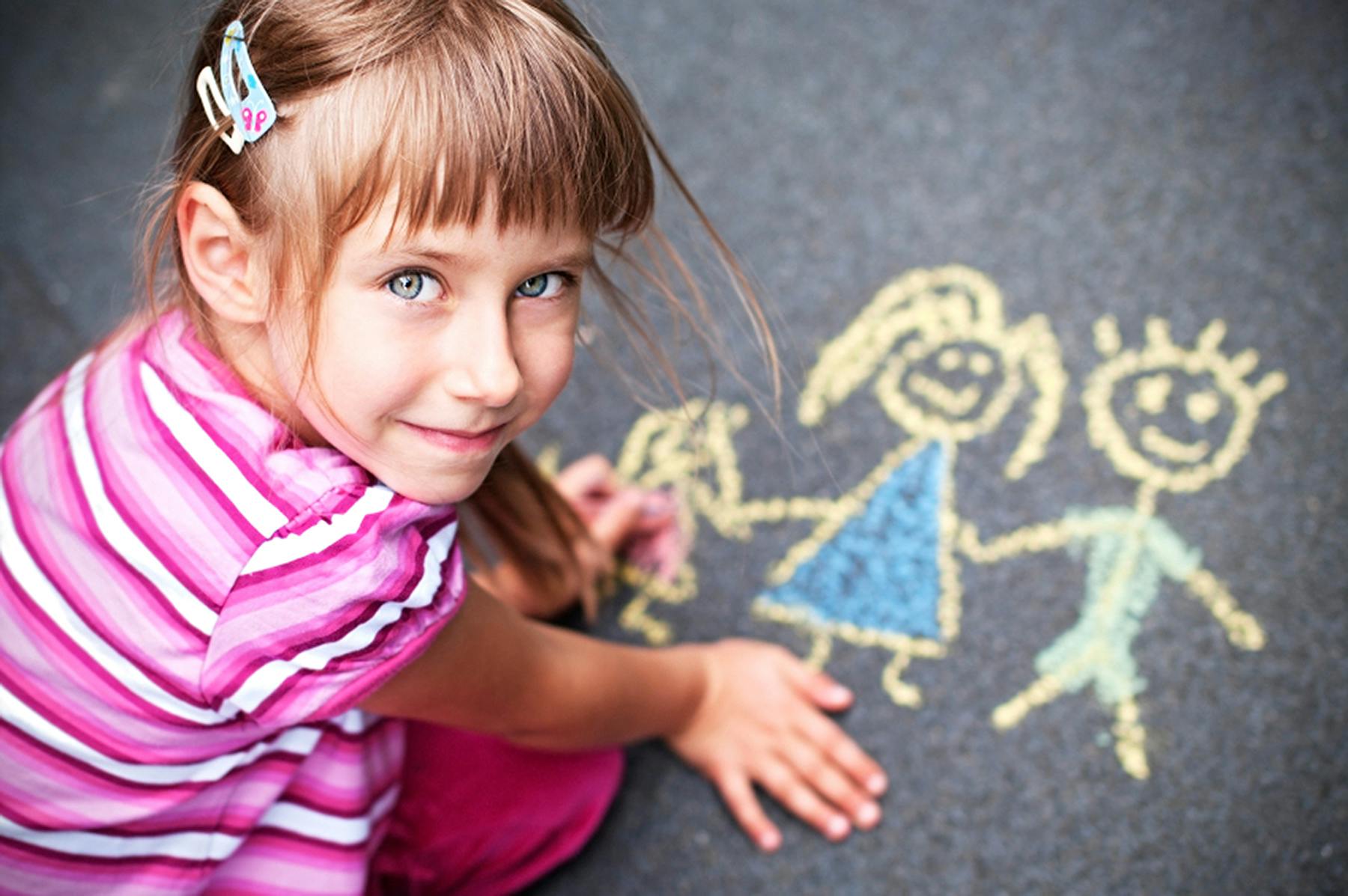 girl drawing with chalk 